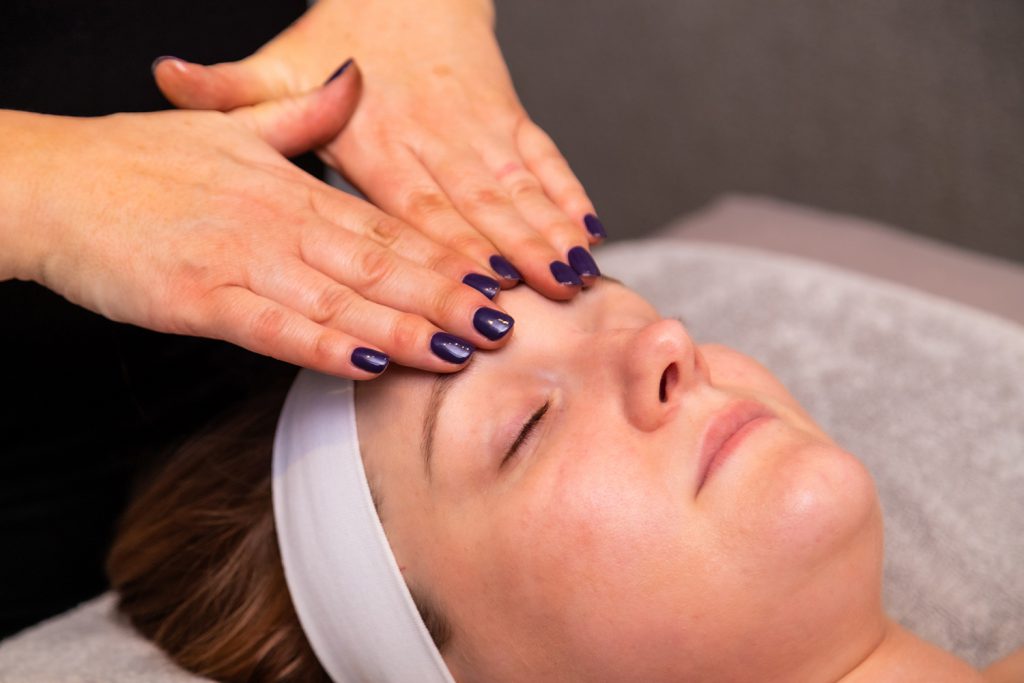 Woman having her forehead massaged